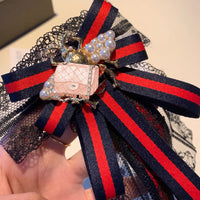 A-accessories gucci Multi-layered bow-knitted brooch bee cravat