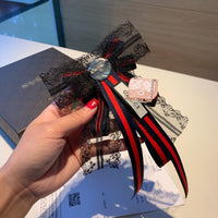 A-accessories gucci Multi-layered bow-knitted brooch bee cravat