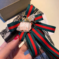 A-accessories gucci Multi-layered bow-knitted brooch bee cravat